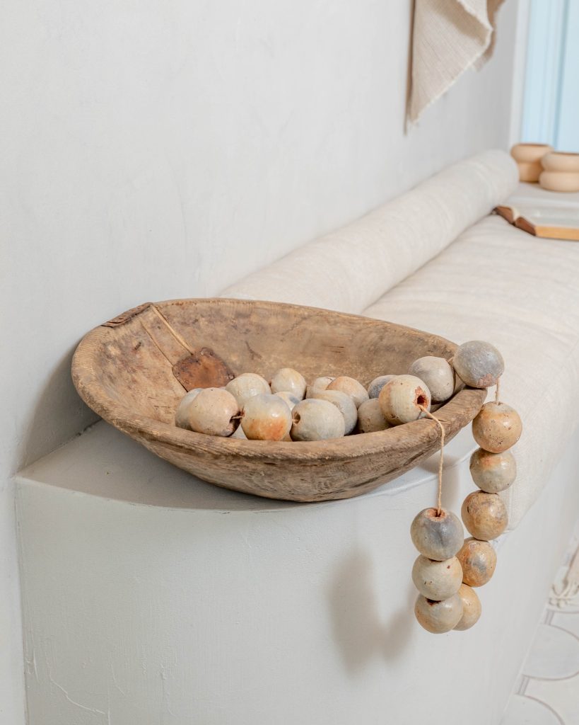 Wooden bowl with decorative beads